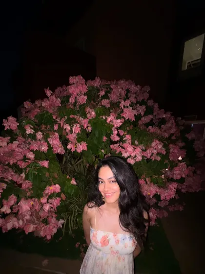 A smiling shot with the flowers. Joyful moments like these are perfect inspiration for an upbeat and happy custom song.