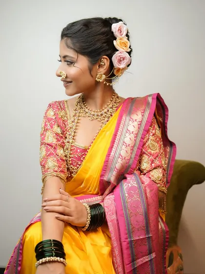 Grace and simplicity, featuring nude tones and a timeless saree with a pastel floral bun.