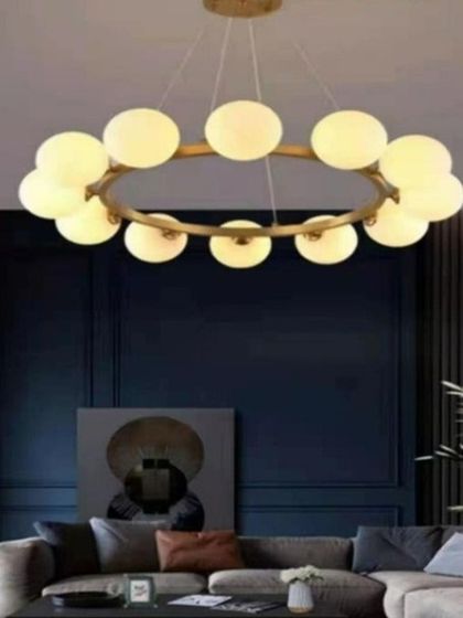 A modern ring chandelier featuring frosted glass balls. This piece provides a soft, diffused light, making it an excellent choice for creating a warm and inviting atmosphere in a living room or bedroom.