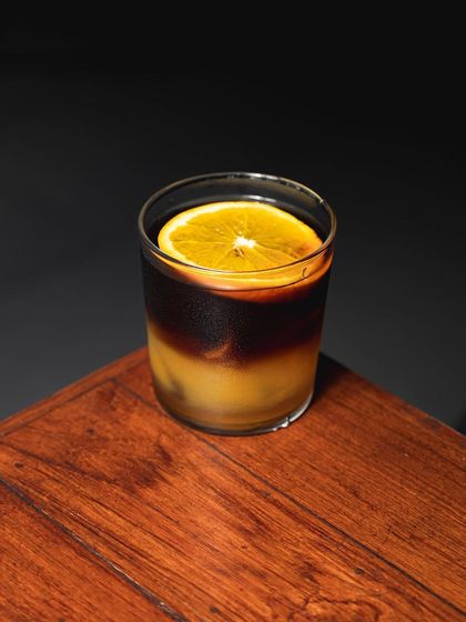 Our Ginger Cheong Cold Brew, a unique fusion of a 3-month matured lime and ginger cheong, topped with fresh orange juice.