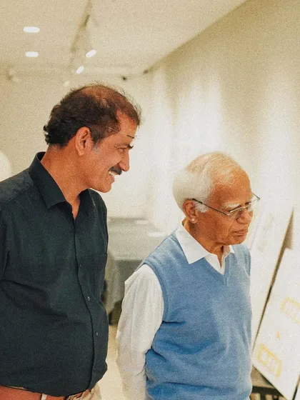 Our principal architect discussing design concepts with a guest at the book launch event, reflecting our commitment to dialogue and shared knowledge within the architectural community.