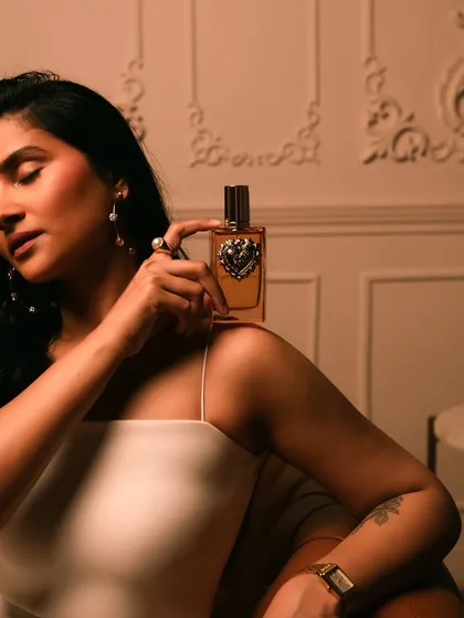 An intimate portrait with the Dolce & Gabbana Devotion fragrance, conveying its warm and sensual notes.