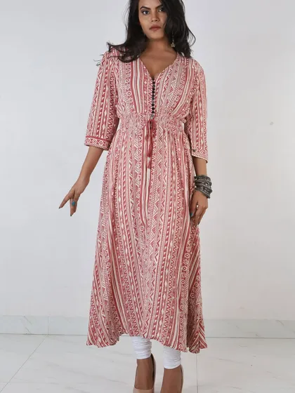 We specialize in lookbook and e-commerce photography for ethnic wear brands. This full-length shot of a model in a printed kurti highlights the garment's flow and design, using precise lighting to ensure true-to-life colors for your online catalog.