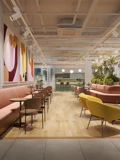 A rendering of the main breakout and cafe area, featuring long banquette seating and vibrant murals. This space is designed to be the social heart of the office, buzzing with energy and color.