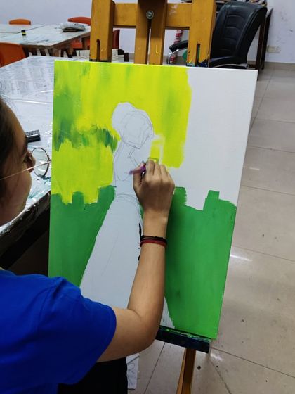 The creation of a colorful, abstract silhouette painting, showing the process of layering bright acrylics to create a stunning final piece.