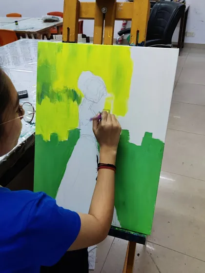 The creation of a colorful, abstract silhouette painting, showing the process of layering bright acrylics to create a stunning final piece.