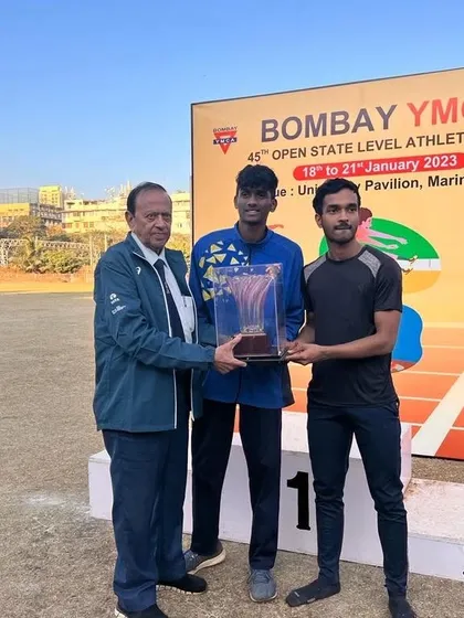Harshal Gaikwad receiving the Individual Championship trophy in the Boys U/18 category at the YMCA State Level meet.