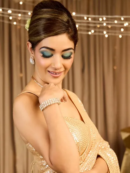 More angles of this stunning vintage French roll. This hairstyle is a timeless choice for a reception or cocktail event, adding a touch of old-world sophistication to any outfit.