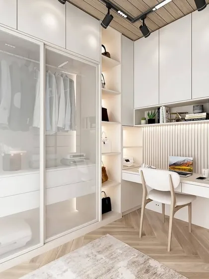 This is how we maximize space with smart design. This bedroom features a floor-to-ceiling wardrobe with translucent sliding doors, integrated with a compact, well-lit study nook, perfect for modern homes.