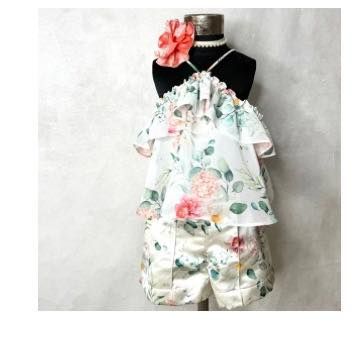 A wider view of our floral halter top and shorts set, showing the delicate, flowy layers of the top. It's a perfect vacation outfit.