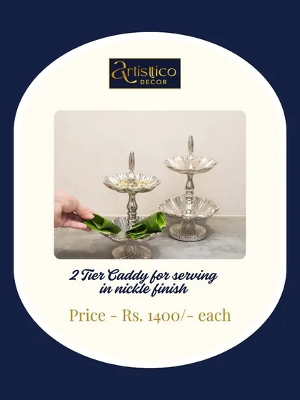 This two-tier caddy in a nickel finish is perfect for serving paan, mukhwas, or small sweets after a meal. Its tiered design saves space while looking incredibly stylish.