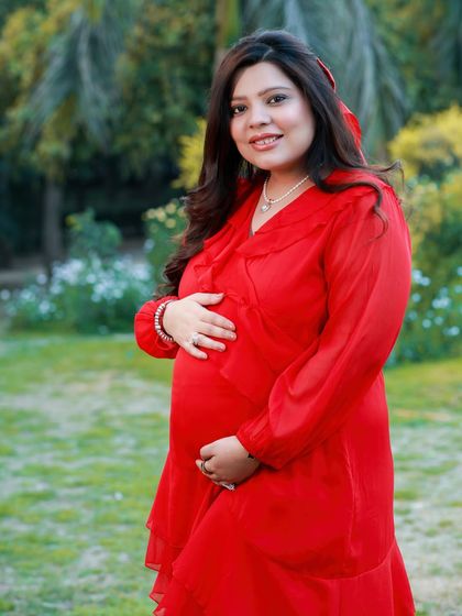A close-up portrait showcasing that beautiful pregnancy glow. The soft, natural light of the outdoors and the simple, happy expression make this a timeless keepsake.