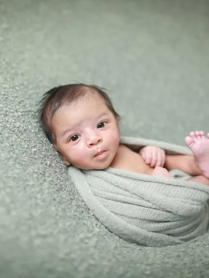 Those tiny feet and that little stretch. Sometimes the most beautiful poses are the ones they find all on their own. A precious, unposed moment.