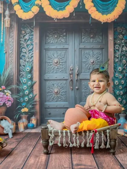 Celebrating with a 'Little Krishna' theme is a beautiful way to honor your traditions. This little one's bright smile perfectly complements the colorful and festive setup in my Thane studio.
