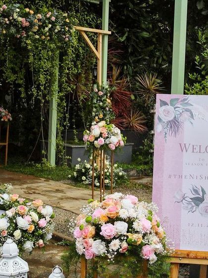 A collection of stunning wedding setups at The Farmhouse Collective. You can see the venue's versatility, from elegant morning ceremonies with floral mandaps to glamorous evening receptions with fairy lights and chic decor. This space is a blank canvas for your dream outdoor wedding in Bengaluru.