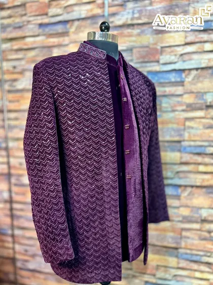 The rich texture of velvet defines this wine-colored Jodhpuri suit. Its deep color and sequin work on the collar and jacket create a regal and luxurious feel, perfect for making a lasting impression at an evening function.