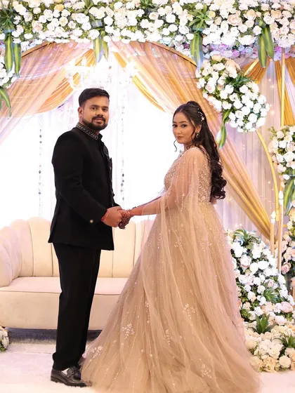 The complete look for her engagement day. Her soft curls and glowing makeup were the perfect match for the grand floral decor and the joy of the occasion.
