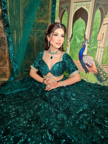 A portrait of the model in her green party attire. The makeup enhances her features and gives her a sophisticated look.