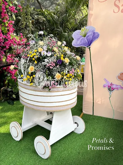 Petals and promises. A beautiful pram prop overflowing with fresh flowers, symbolizing the new life about to bloom.