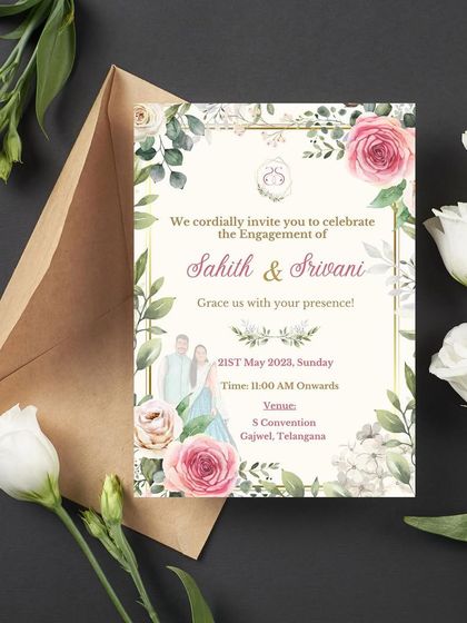An engagement invitation that portrays a blossoming romance. This design for Sahith and Srivani features their custom illustration framed by a border of lush greenery and soft pink roses.