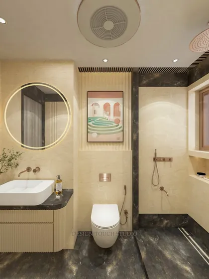 A front-on view of the toilet and the beautiful art piece on the wall, which adds a pop of color to the neutral space.