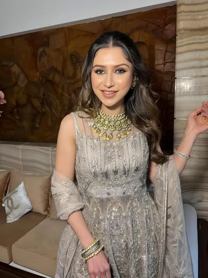 A close-up portrait, her smile and glowing skin stealing the show.