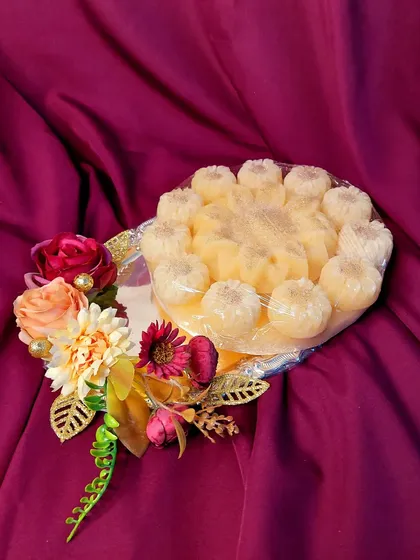 This decorated platter was created for a Godhana ceremony, an important pre-wedding ritual. I use beautiful floral arrangements and traditional elements to make these ceremonial trays special and photo-ready.