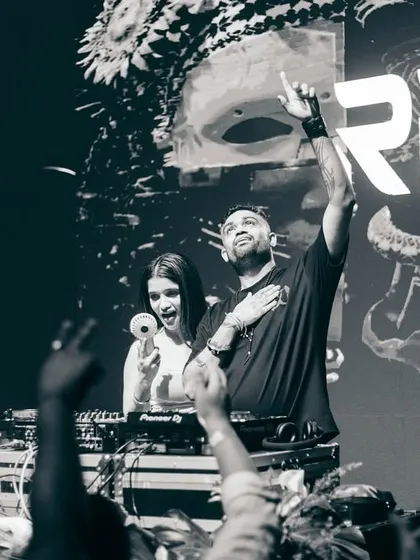 A black and white shot with a fan, showing the connection I build with my audience.