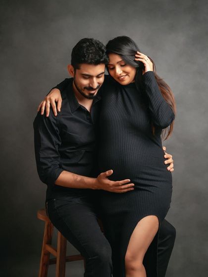 An intimate and loving embrace. This pose beautifully showcases the baby bump while capturing the close bond between the partners.