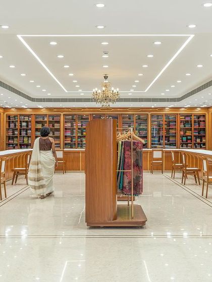 The first floor is dedicated to wedding silks, featuring a more traditional layout with wall-to-wall shelves and long counters. We updated this classic format to improve the customer experience and flow.