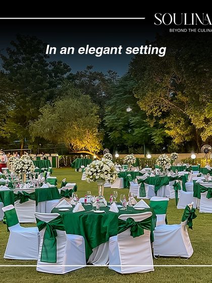 An elegant outdoor setting for a year-end celebration, with tables dressed in green and white. We create beautiful moments in any environment.