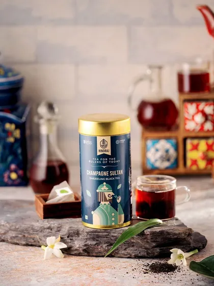A different take on the Champagne Sultan tea, styled with rustic stone and a traditional tiled background. This version offers a more earthy and artisanal feel while still maintaining a premium look.