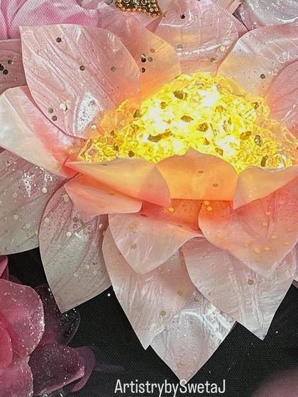 A detailed shot of the glowing lotus, crafted from resin and filled with light. It's the centerpiece of this divine artwork, symbolizing purity and enlightenment.