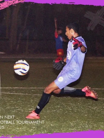 A goalkeeper in action during our GenNext Football Tournament, demonstrating proper technique.