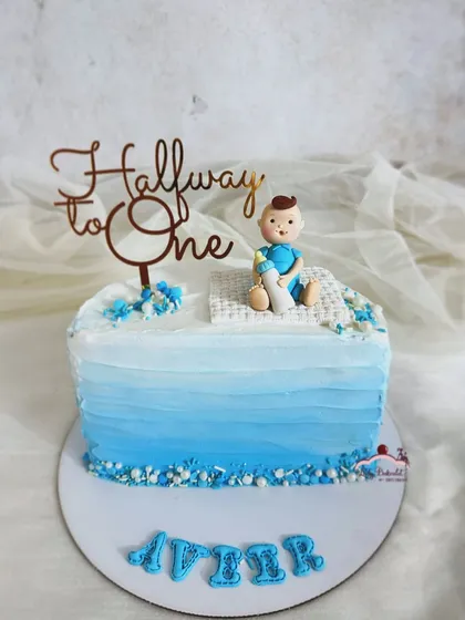 Because a whole year is too long to wait! A "Halfway to One" cake for baby Aveer, with a blue ombre buttercream finish.
