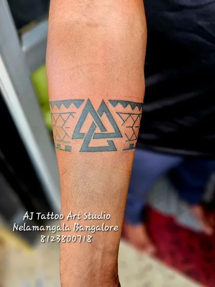 A geometric armband featuring interlocking triangles, a symbol with Norse origins.