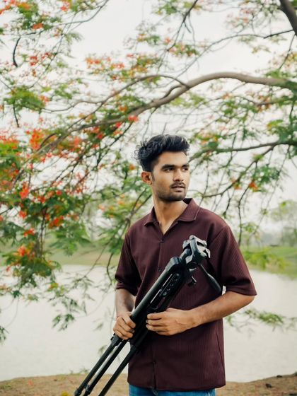 Ready for the next shot with my tripod. I use professional equipment to ensure every photo and video is of the highest quality.