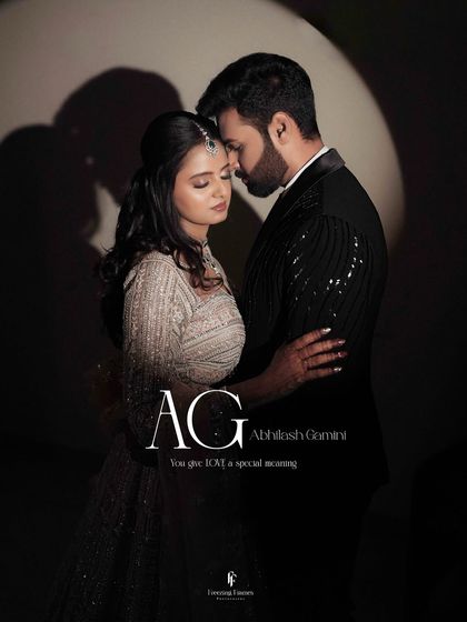 A romantic, moody portrait of the couple embracing, with their initials "AG" and a sweet caption.