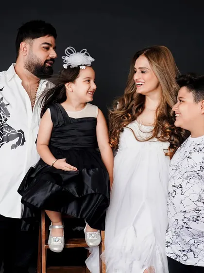 A beautiful family portrait capturing a moment of love and connection between all four family members.