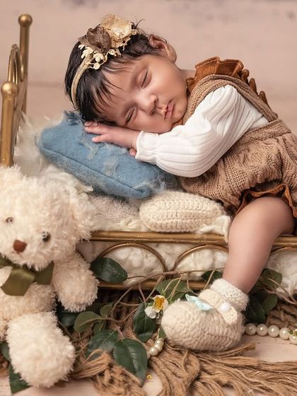 In this variation of the princess setup, the baby is joined by two sweet teddy bears. Using different props allows me to create a variety of shots within one theme.