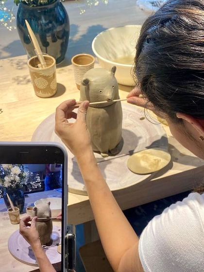 This is Swathi, a client turned student, working on a sculpted animal figure. She is now launching her own pottery studio, and I am so proud to have been part of her journey.