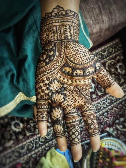 A minimal mehendi design for a bride who wanted something simple and elegant. The pattern focuses on lotus and elephant motifs with plenty of open space.
