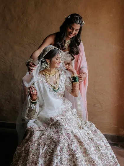 Another beautiful portrait of the bride and her sister. The makeup for both was designed to look flawless in photos and in person.