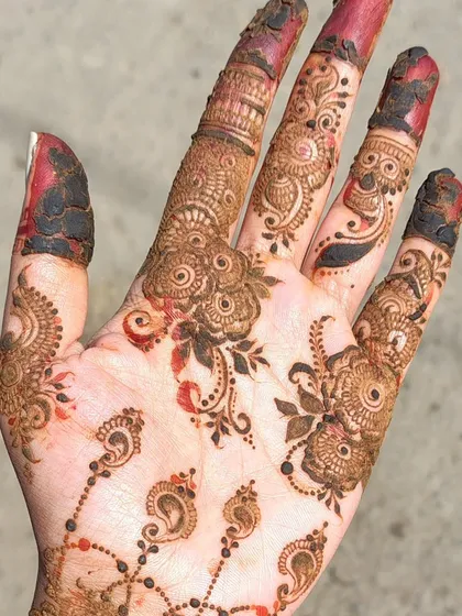 A beautiful example of an Arabic-style design after the henna paste has been removed. The stain is a lovely orange-red, which will darken over the next 48 hours.