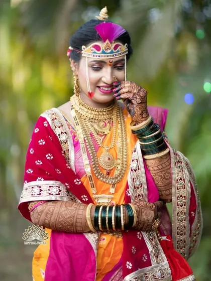 A shy and beautiful smile from a Maharashtrian bride. Her hands, adorned with my mehndi, add to the traditional charm of her look.