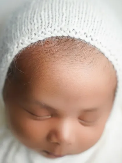 The delicate fuzz on a newborn's forehead, a detail that vanishes in just a few weeks. My newborn detail shots are dedicated to capturing these fleeting features.