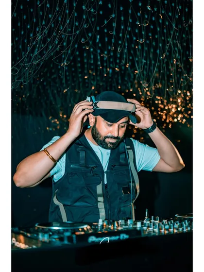 A clear, professional shot of me getting ready for a set. This moment of focus is crucial before the music starts and the party begins.