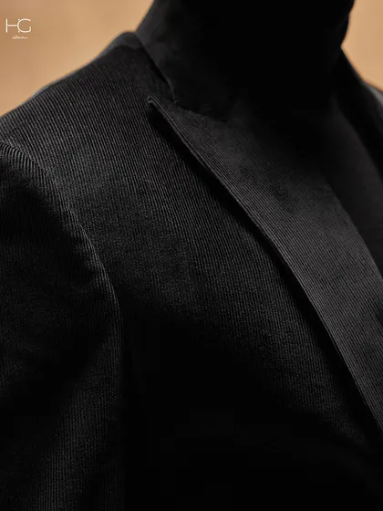 A close-up on the lapel of the corduroy suit. The texture of the fabric is the main detail, offering a tactile richness that sets it apart.