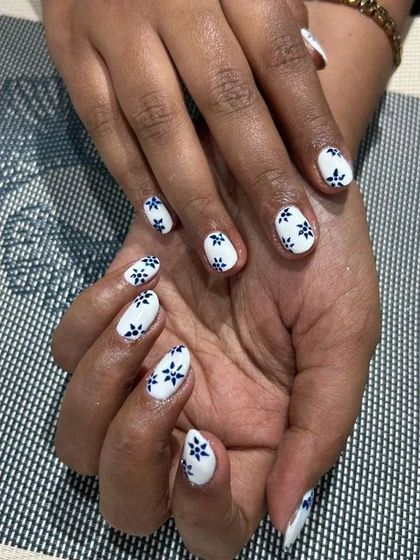 The full view of the blue and white floral nail art. It's a clean, fresh, and sophisticated look for natural nails.