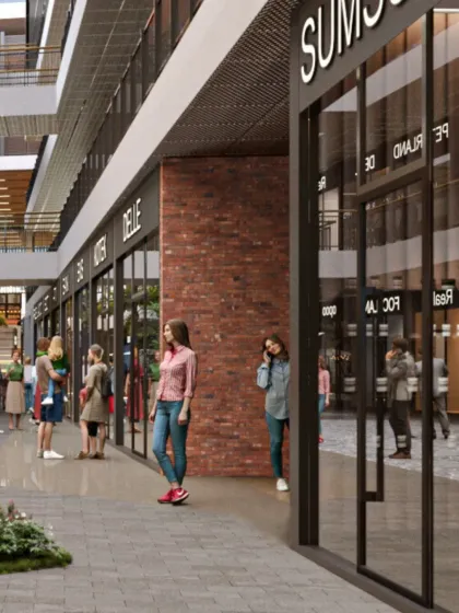 A close-up view of a pedestrian walkway in one of our retail developments. The use of tactile materials like brick and the human scale of the storefronts create a welcoming and engaging experience for shoppers.
